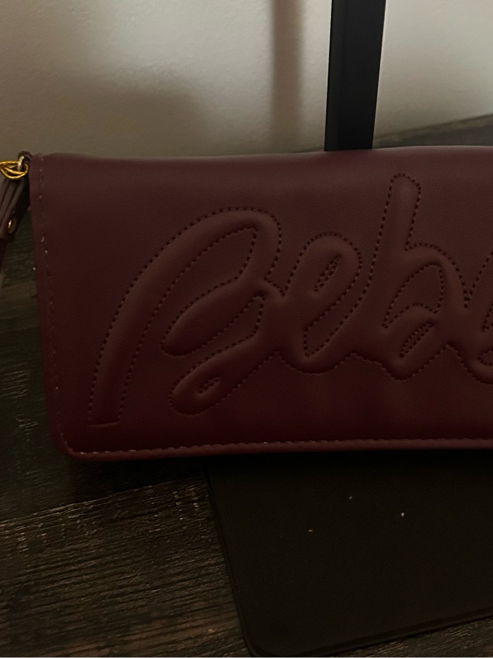 bebe Quilted Script Clutch in Burgundy